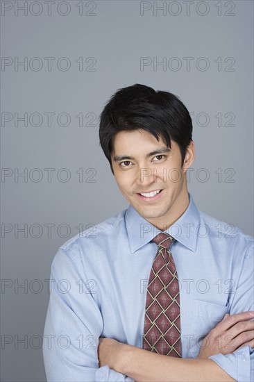 Portrait of happy young businessman. Photo: Rob Lewine