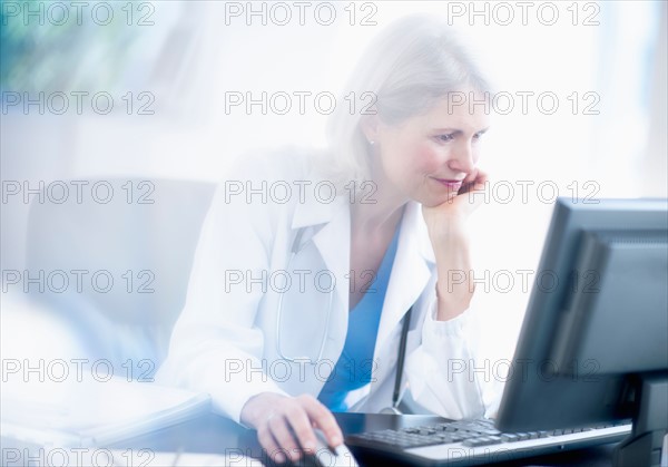 Senior female doctor working in her office.