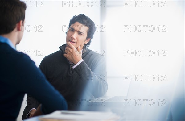 Two businessmen in discussion.