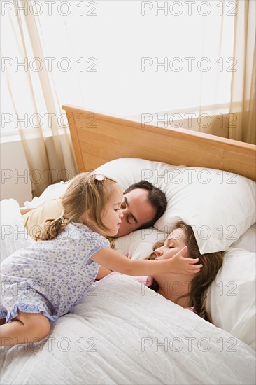 Daughter waking up parents. Photo : Rob Lewine