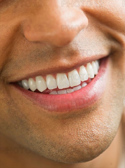 Close-up of man's perfect teeth.