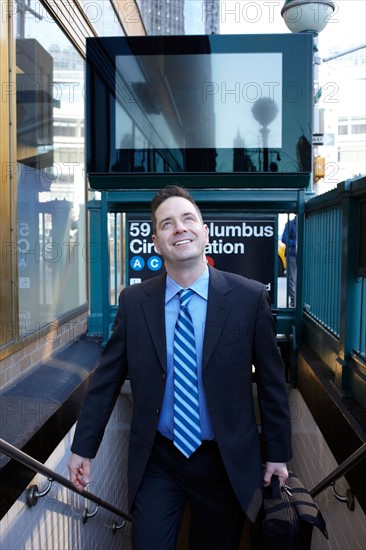 USA, New York, New York City. Portrait of businessman in city. Photo : Winslow Productions