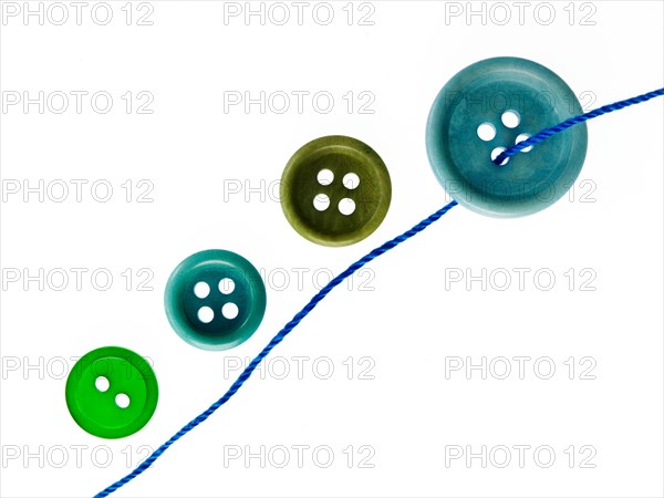 Studio shot of green marbles arranged in Exclamation Point. Photo : David Arky