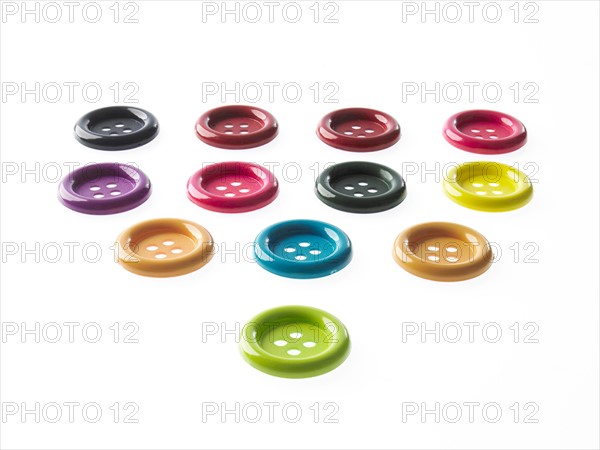 Studio shot of large group of multi colored buttons. Photo : David Arky