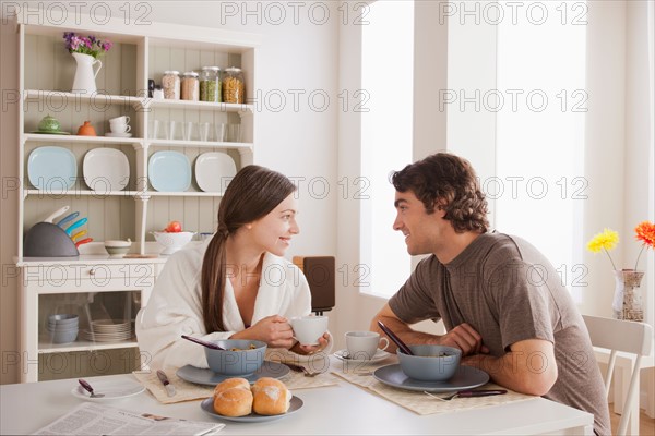 Young couple eating breakfast. Photo : Rob Lewine