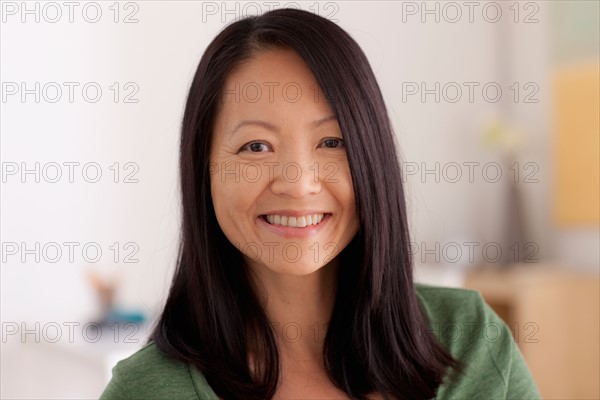 Portrait of woman smiling. Photo : Rob Lewine