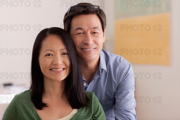 Portrait of couple smiling. Photo : Rob Lewine