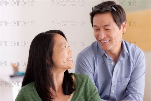 Portrait of couple smiling. Photo : Rob Lewine