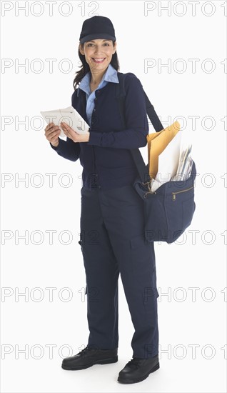 Studio shot of female postal worker.