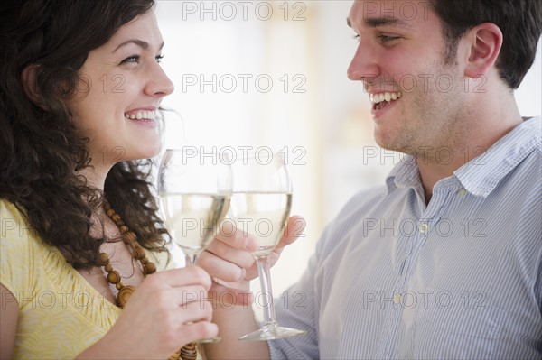 Couple toasting with wine. 
Photo: Jamie Grill
