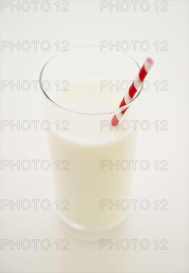 Close up of glass of milk with straw. 
Photo: Jamie Grill