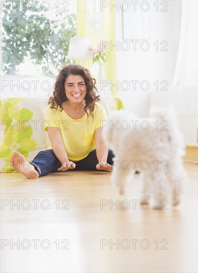 Woman playing with her dog. 
Photo: Daniel Grill