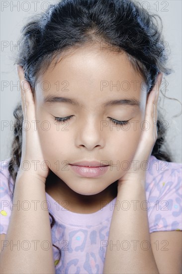 Portrait of girl (6-7), studio shot. 
Photo: Rob Lewine