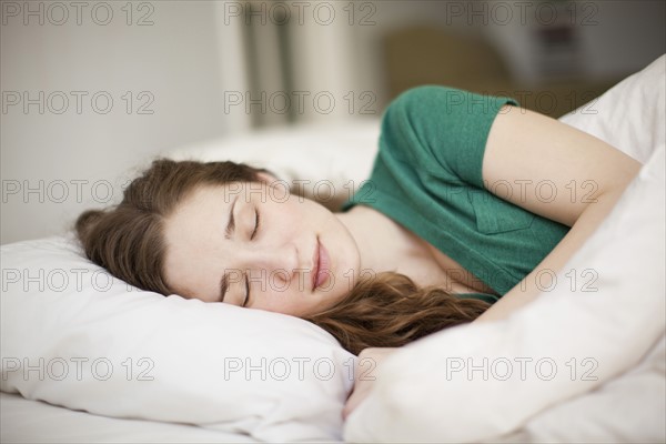 Young woman sleeping in bed. 
Photo: Jessica Peterson