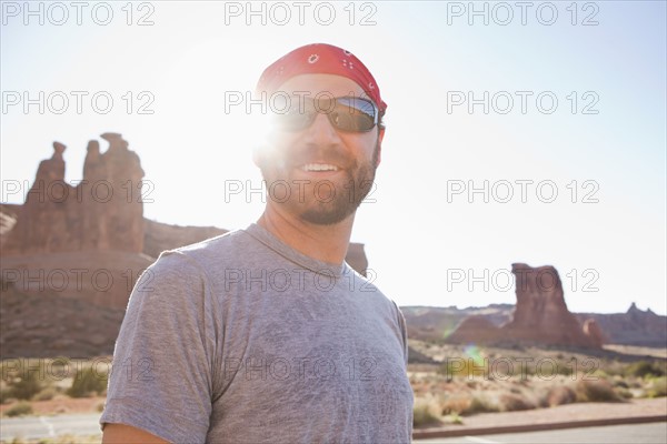 USA, Utah, Moab, Mid adult man posing in cycling gear. 
Photo: Jessica Peterson