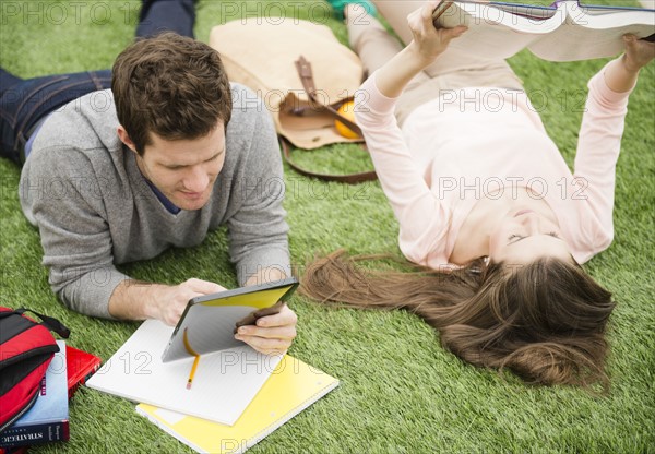 Couple learning on grass. Photo : Jamie Grill