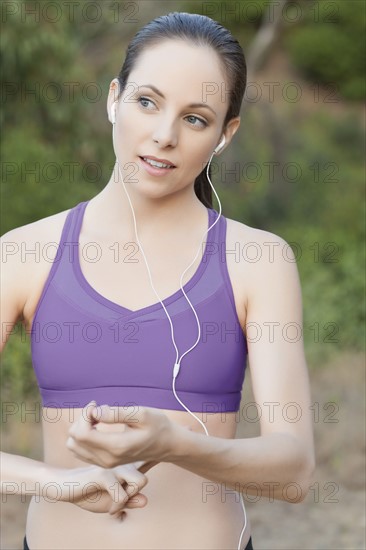 Woman exercising with headphones on. Photo: Sarah M. Golonka