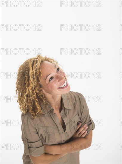 Portrait of young woman on white background, studio shot.