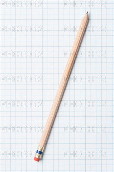 Single wooden sharpened pencil on graph paper. Photo: Kristin Duvall