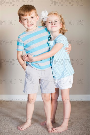 Portrait of hugging siblings. Photo: Jessica Peterson