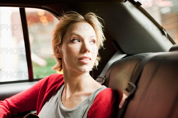 Portrait of woman on back seat of car. Photo: Jessica Peterson