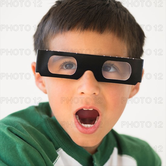 Portrait of boy (6-7) wearing 3d glasses.