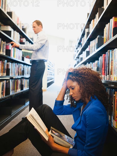 View of man and woman researching library