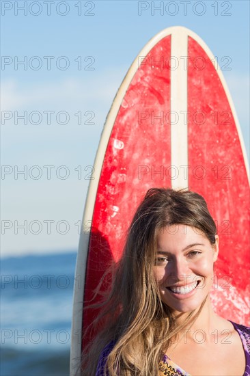 Portrait of woman with surfboard. Photo: Jamie Grill