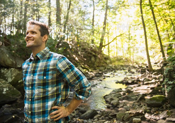 Man standing in forest. Photo: Jamie Grill