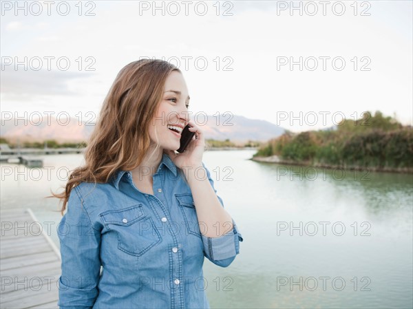 Portrait of young woman talking on phone. Photo: Jessica Peterson