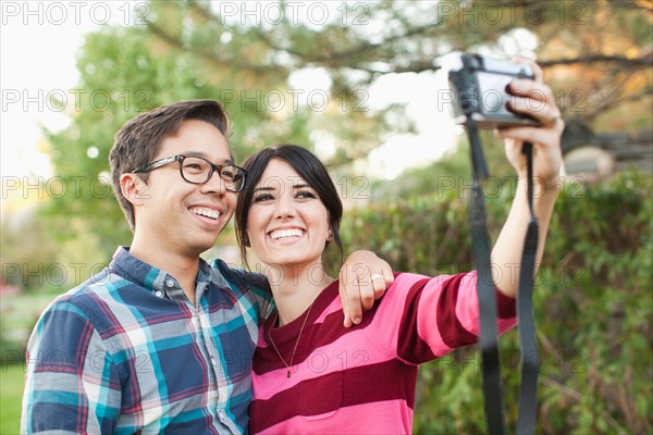 Couple taking self-portrait picture. Photo: Jessica Peterson