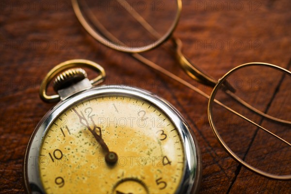 Antique clock and glasses.