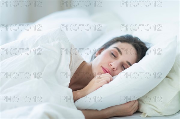 Woman sleeping in bed.