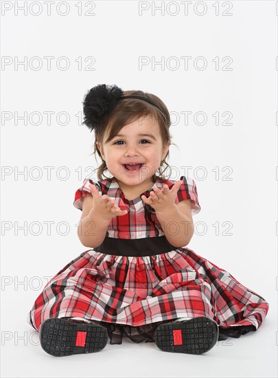 Portrait of Baby girl ( 6-11 months) wearing plaid dress