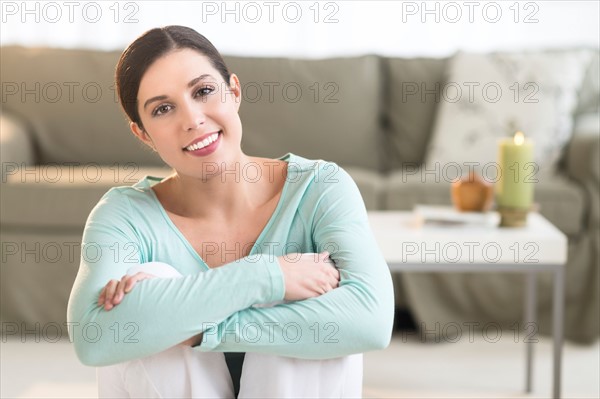 Woman sitting in living room.