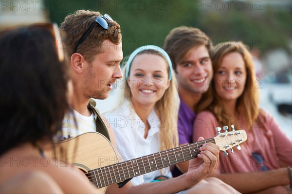 Group of friends relaxing at beach