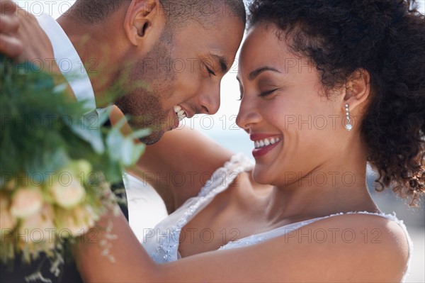 Bride and groom embracing