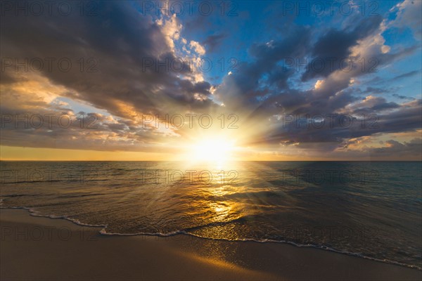 Sun setting over sea. Jamaica.