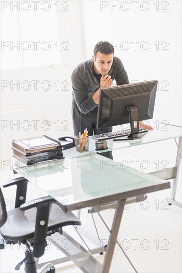 Businessman working at desk.