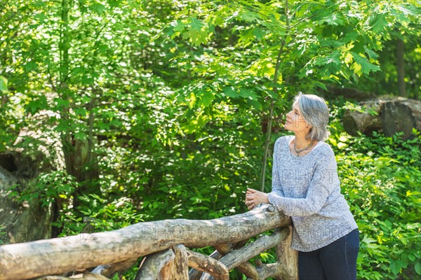 Central Park, New York City. Senior woman relaxing in park.