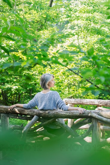 Central Park, New York City. Senior woman relaxing in park.