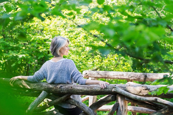 Central Park, New York City. Senior woman relaxing in park.