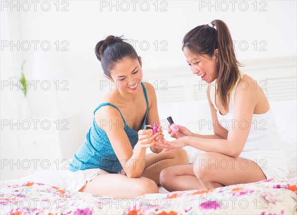 Two women doing manicure