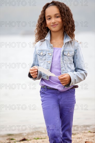 Girl (8-9) on Sea Cliff