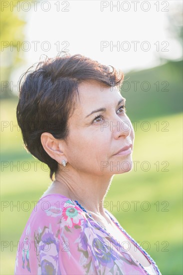 Portrait of mature woman outdoors.