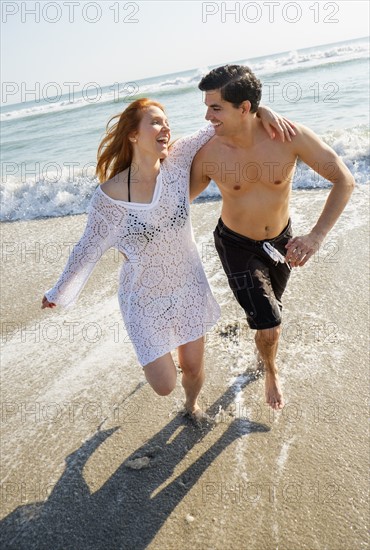 Portrait of couple on beach.