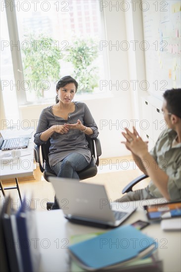 Couple working in office.