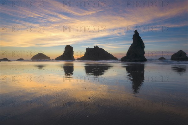 Beach with stack rocks at sunset