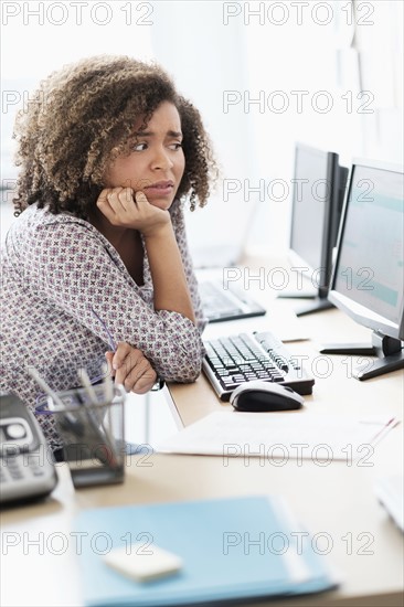 Young woman working at office.