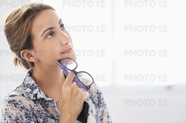 Young woman working in office.